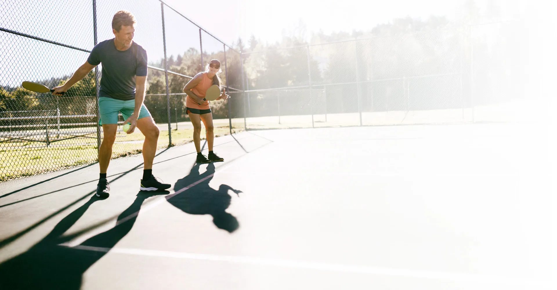 couple playing pickleball