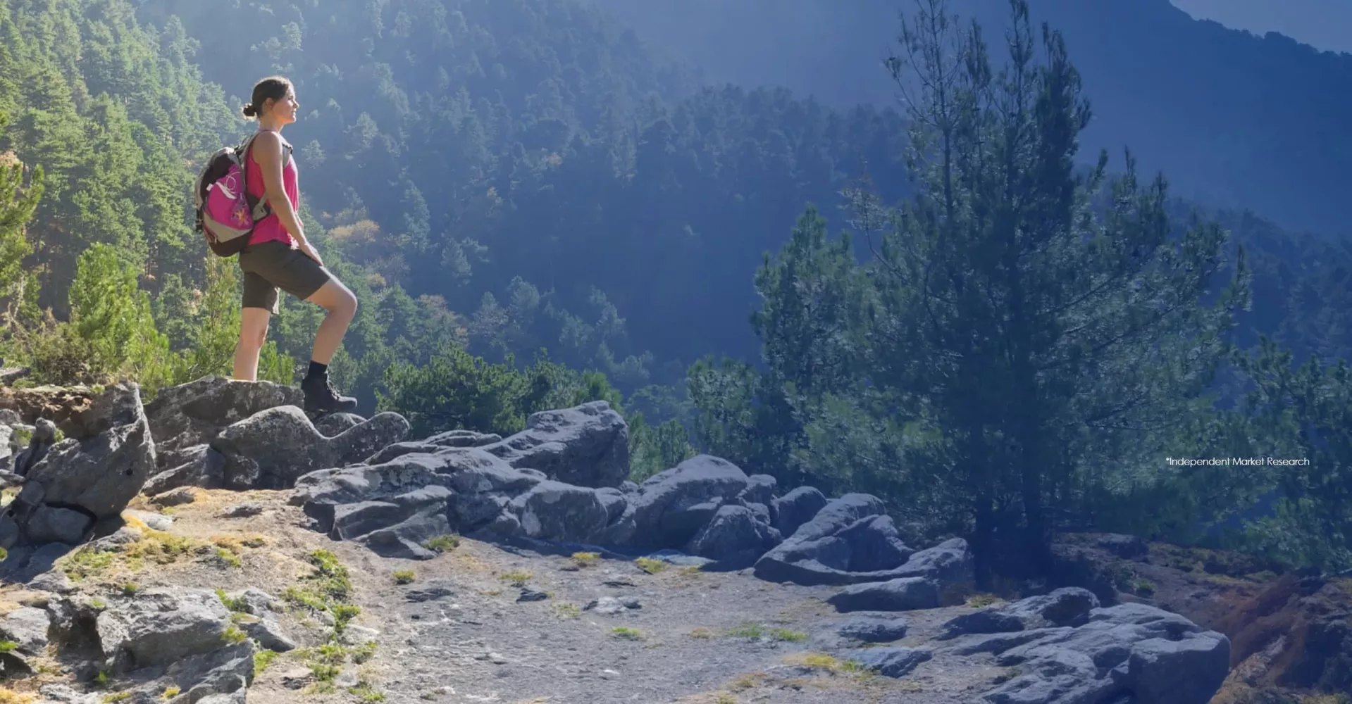 THE REGION’S MOST PREFERRED: young woman hiking a mountain