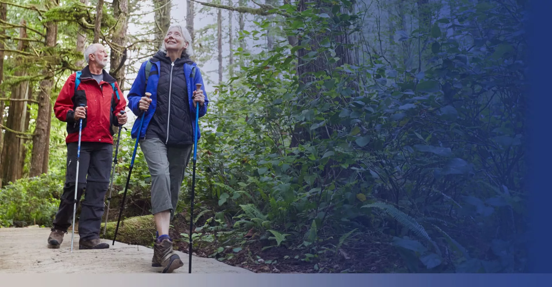older couple hiking on a trail