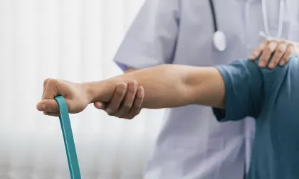 man exercising with resistance band