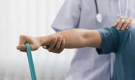man exercising with resistance band